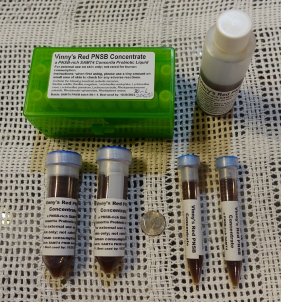 This photo shows very-high-PNSB SAMT4 liquid from PNSB brew batch 5A-1-5G in various sized containers. This batch has a pH of around 7.5 and exhibits a level of PNSB microbes on the order of at least 2.00x10E+10 cfu/ml.